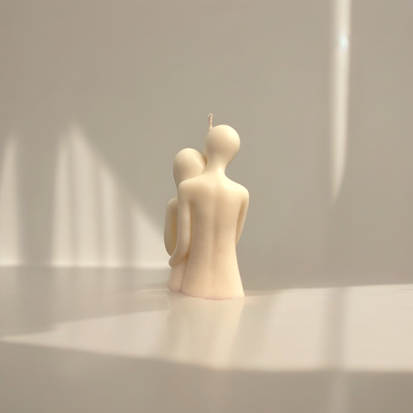 Embracing couple candle